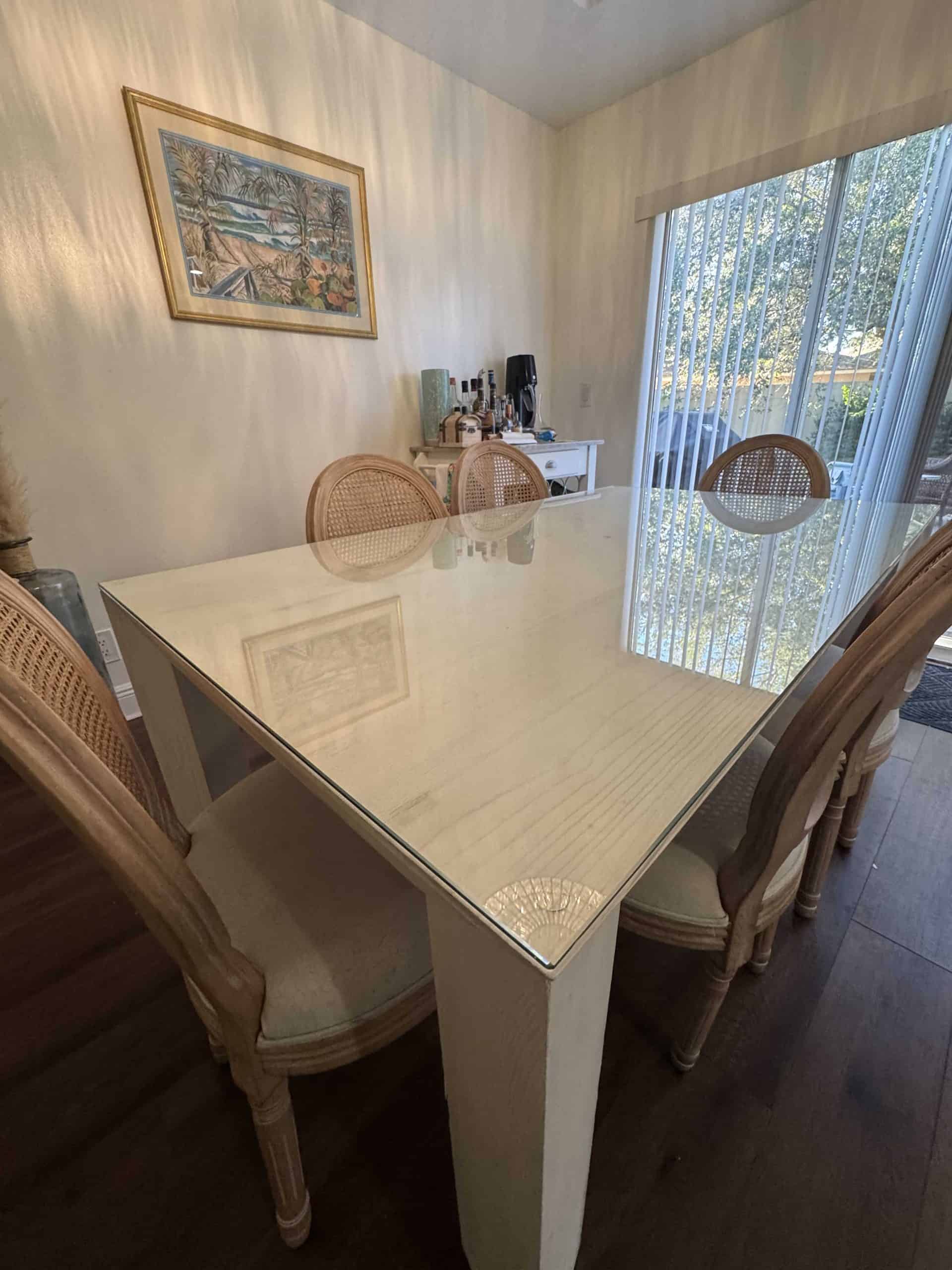 Custom glass table top on a dining table in Stuart, FL